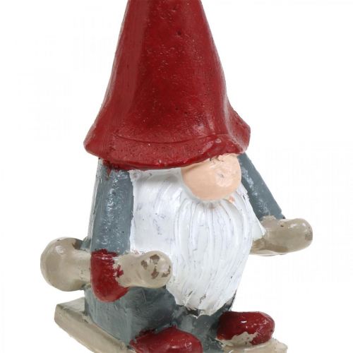 Floristik24 Motívum gyertya Karácsonyi manó, adventi dekoráció, manó síléccel, díszgyertya H12cm