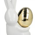 Floristik24 Elegáns húsvéti nyuszi, kerámia nyuszi arany tojással, húsvéti dekoráció fehér, arany H18cm 2db