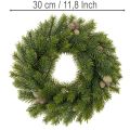 Műfenyőág koszorú tobozokkal ajtóra vagy asztalra, 30cm | Floristik24.hu